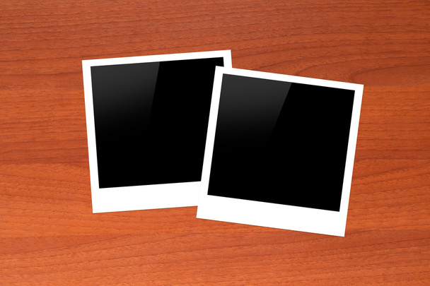 Blank Picture Frames on Wooden Table - Фото, зображення