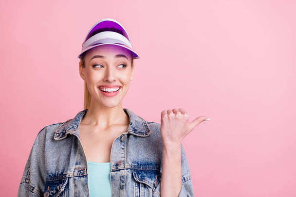Portrait of attractive cheerful curious girl demonstrating solution copy space ad offer isolated over pink pastel color background - Φωτογραφία, εικόνα
