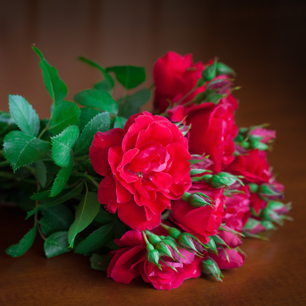 Beautiful bouquet of flowers on wooden table old. - Fotó, kép