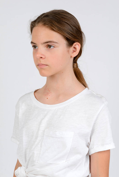 Young girl in white t-shirt model snap front-side look close up on white background - Φωτογραφία, εικόνα