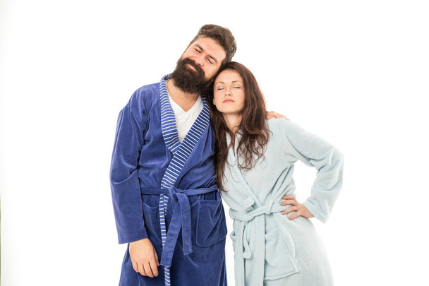 Tired couple of man and woman stand sleeping in cozy robes isolated on white, asleep - Valokuva, kuva