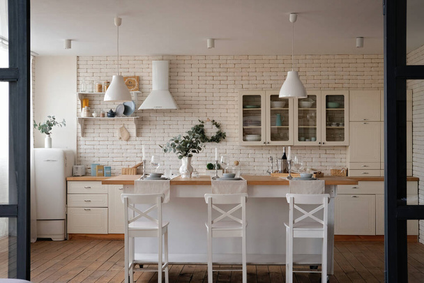 Modern stylish white and light wood Scandinavian kitchen interior with kitchen accessories. - Foto, Bild