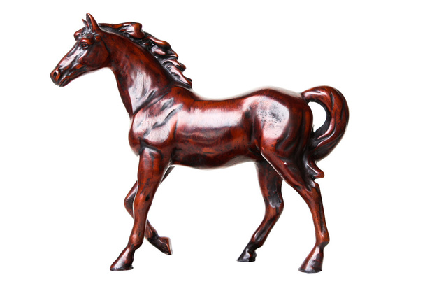 歩く馬の彫刻に孤立した白い背景 - 写真・画像