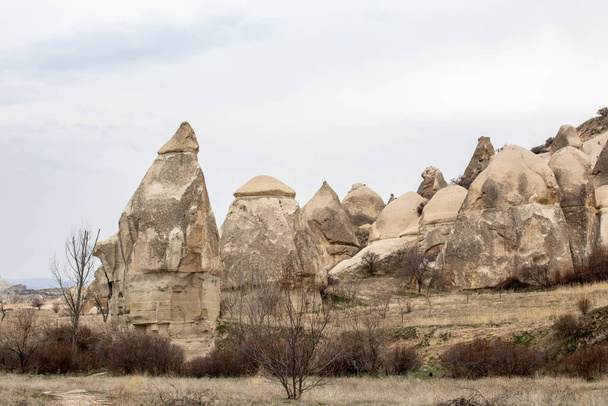 Cappadocia Turkey. Houses of local residents, dug in the sandy rocks. Dwelling of ancient people. UNESCO Monument - Foto, Imagem