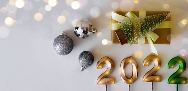 Happy new year background flat lay with place for text golden numbers 2022 format banner. - Photo, Image