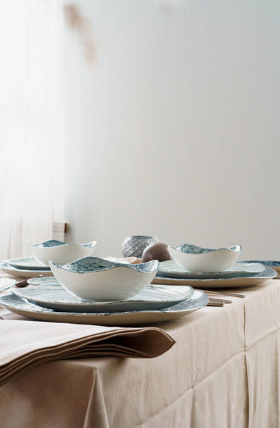 Table setting with stylish dishware on beige tablecloth - Φωτογραφία, εικόνα