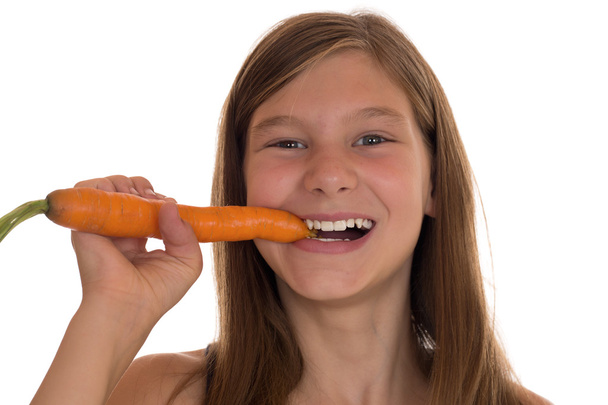 Healthy eating young girl with fresh carrot - Photo, Image
