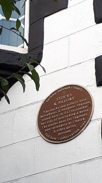  Plaque in Padiham telling the story  that in 1612 Margaret Pearson, an accused witch in the Pendle Witch Trials who after she confessed to bewitching a horse her punishment was to be pilloried in 5 different towns.But she did not hang - Photo, Image