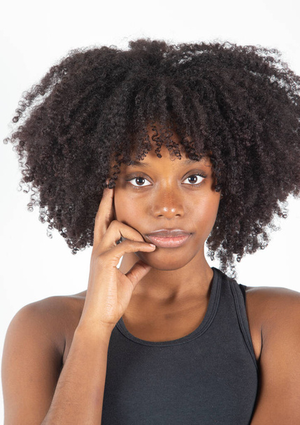 Closeup young black woman, white background - Foto, imagen