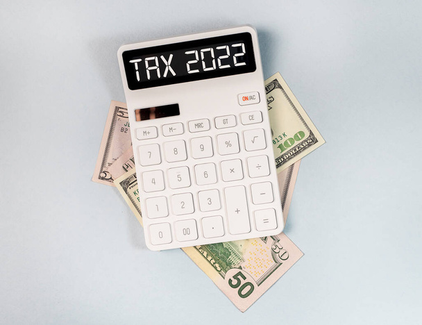 Tax 2022, calculator and money. Taxation and calculation concept - Photo, Image