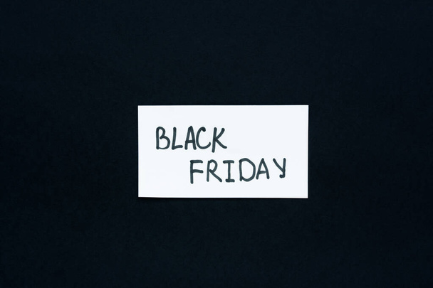 Black Friday text. Black background white sheet hand lettering marker. Conceptual business minimalism. The concept of sales, promotions, discounts, online purchases. Horizontal banner, strict design - Photo, Image