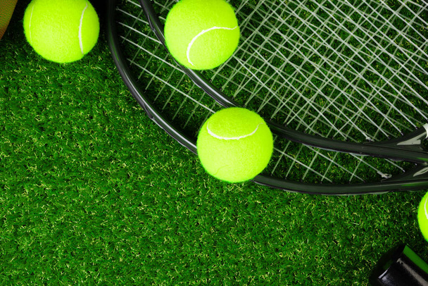 Tennis balls on grass close up. Tennis equipment - Photo, image