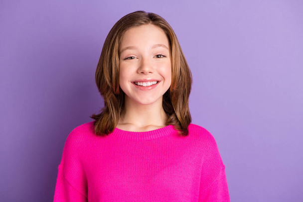 Photo of happy charming small girl wear pink sweater smile good mood isolated on violet color background - Foto, Imagem