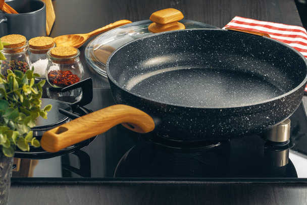 Frying pan on the gas stove in a kitchen - Photo, image
