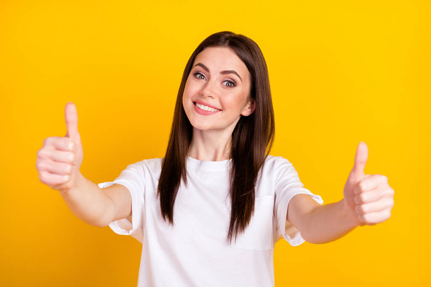 Photo of happy good mood positive lovely beautiful girl showing you thumb-up good job isolated on yellow color background - Foto, immagini
