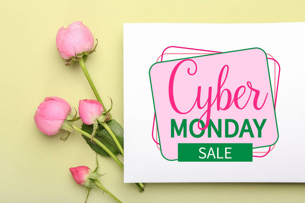 Paper sheet with text CYBER MONDAY SALE and beautiful roses on color background - Foto, immagini
