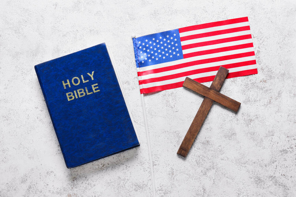 Holy Bible with flag of USA and cross on white background - Foto, imagen