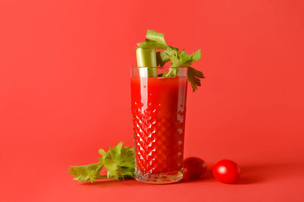 Glass of bloody mary with celery and tomatoes on color background - Φωτογραφία, εικόνα