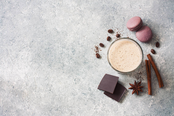 Chocolate milk drink , macaroons, chocolate and coffee beans on gray stone background. Top View. Copy Space - Foto, Imagem