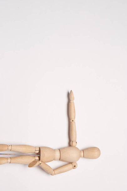 wooden mannequin toy object posing design light background - Foto, immagini