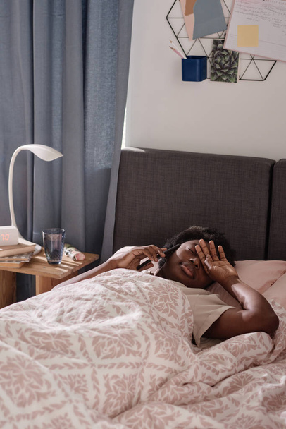 Woman talking on the phone in bed - Φωτογραφία, εικόνα