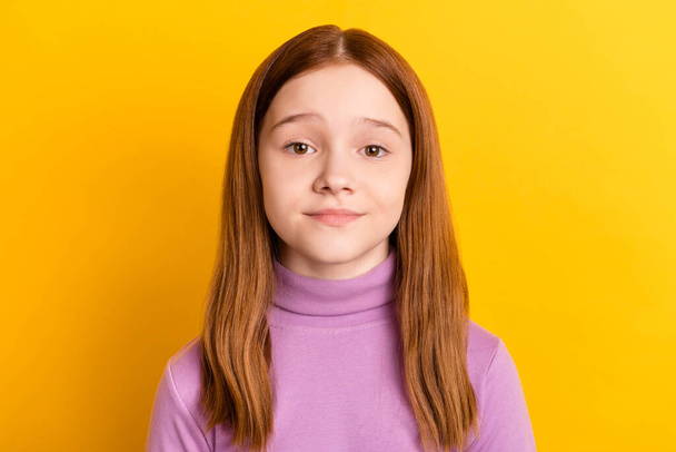 Close-up portrait of attractive red-haired girl wearing lilac pullover isolated over bright yellow color background - Фото, зображення