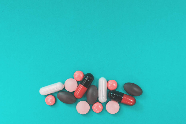 multicolored pills texture on blue background - Φωτογραφία, εικόνα