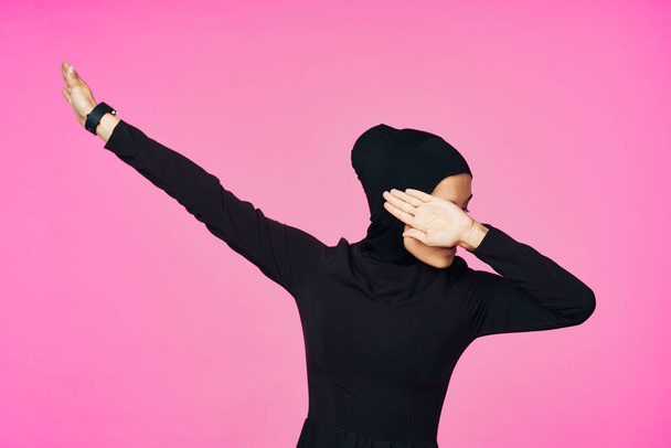 muslim woman in black hijab posing hand gesture model - Фото, изображение