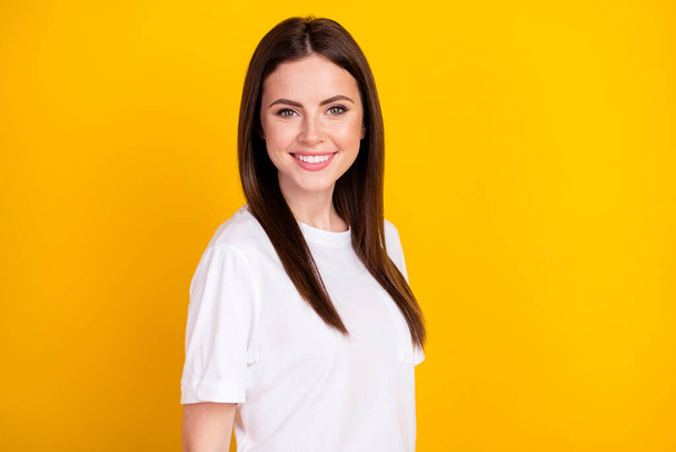 Photo of young happy smiling good mood pretty charming girl wear white t-shirt isolated on yellow color background. - Fotoğraf, Görsel