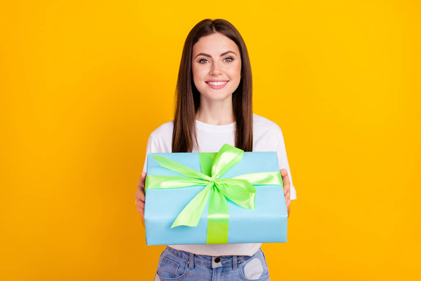 Photo of happy cheerful beautiful stunning lovely girl give you birthday gift present isolated on yellow color background. - Foto, Bild