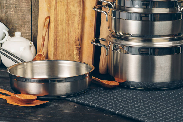 Set of stainless steel saucepans in a kitchen - Fotografie, Obrázek