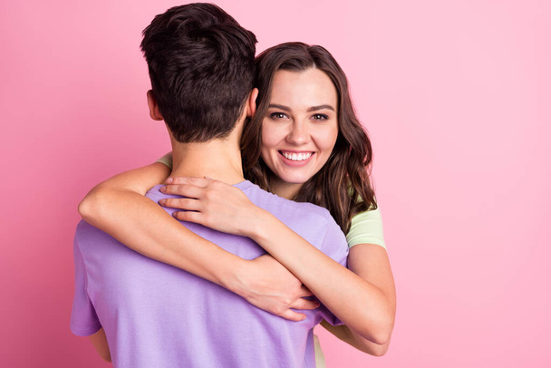 Portrait of attractive tender sweet gentle cheerful couple embracing amour isolated over pink pastel color background - Фото, изображение