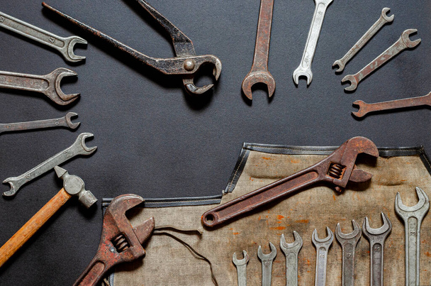 Vintage old tools on stone backdrop. Top view with copy space. Flat lay. Old rusty tools closeup. Old tools in the workshop. - Photo, Image