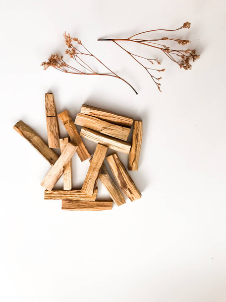 A set of wooden sticks Palo Santo on a white background. Aromatherapy and religious rites and meditations. Organic holy tree incense from Latin America top view - Fotoğraf, Görsel
