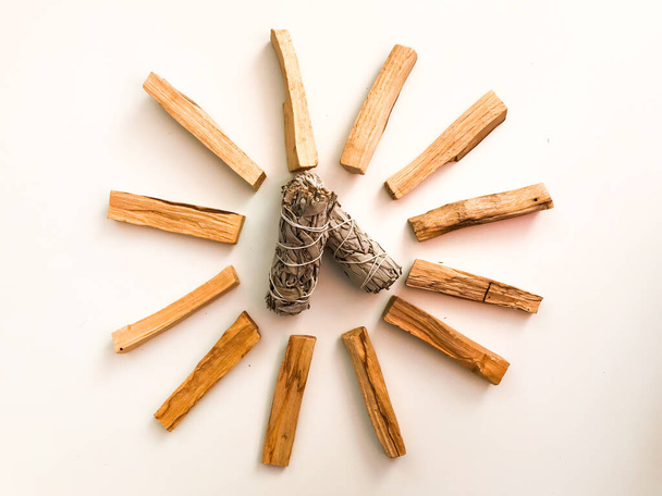 Natural incense White Sage and Palo Santo. Sacred tree of South America, color square photo.White Sage and Palo Santo on white background.  - Foto, immagini