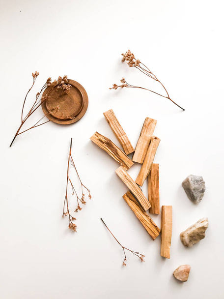 A set of wooden sticks Palo Santo on a white background. Aromatherapy and religious rites and meditations. Organic holy tree incense from Latin America top view - Foto, imagen