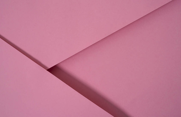 abstract pop up paper background in pink. abstract arrangements build a geometric texture for wallpaper, posters, flyers, etc. - 写真・画像