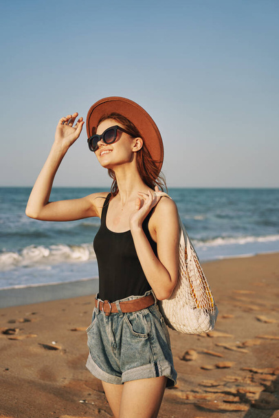 woman walking on the beach landscape sun fun lifestyle - Photo, Image