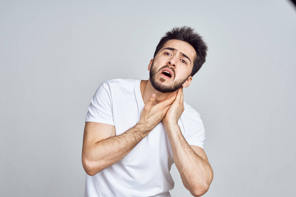 bearded man in white t-shirt posing gesturing with his hands - Photo, image