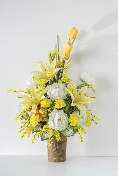 front view beautiful yellow and white flowers bouquet on pottery vase,white background,copy space - Photo, Image
