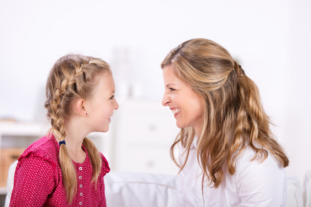 Mother and daughter laughing at each other - Foto, Imagen