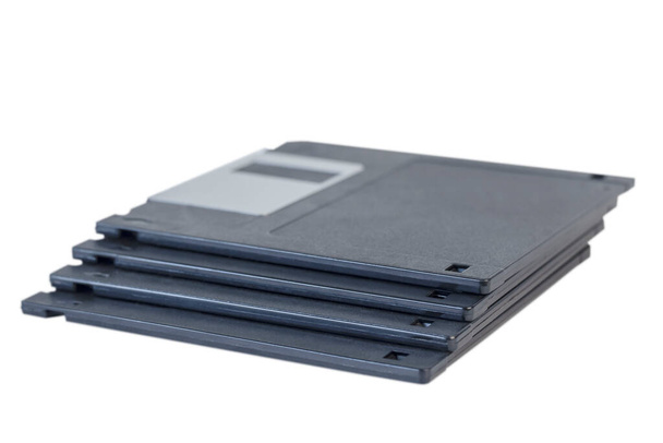 vier übereinander gestapelte Disketten isoliert auf weiß - Foto, Bild