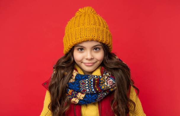 winter fashion. cheerful kid with curly hair in hat. female fashion model. teen girl in scarf. - Фото, изображение