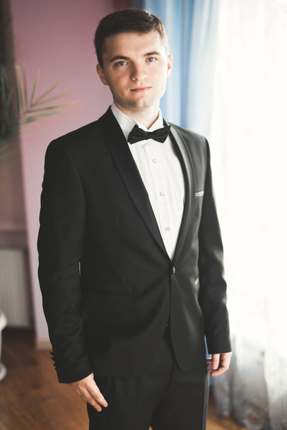 Beautiful man, groom posing and preparing for wedding - Zdjęcie, obraz