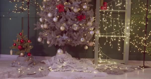 Christmas tree and many gifts in room, video with stop motion effect - Footage, Video
