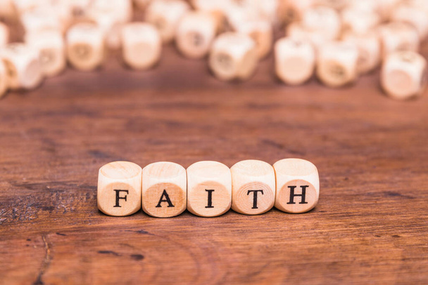wooden cubes with word faith table. High quality photo - Foto, Bild
