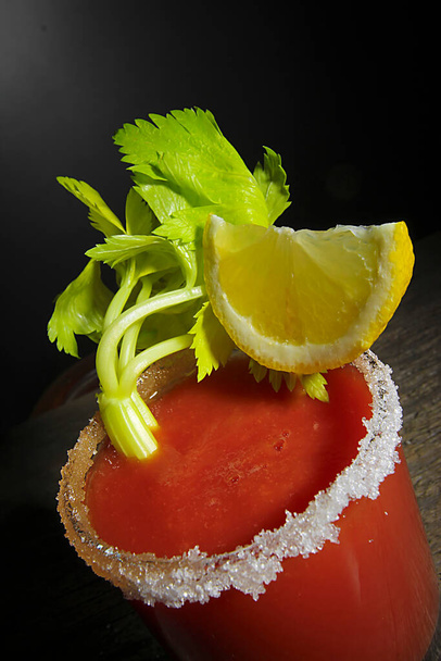 Bloody Mary cocktail with celery and lemon - Фото, зображення