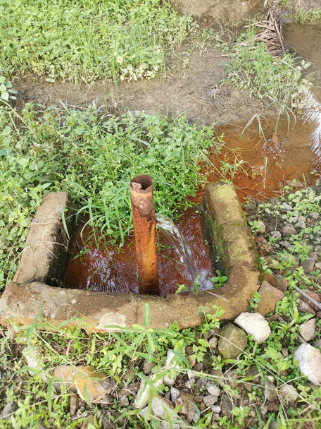 corroded water leakage pipe at the farm - Photo, Image