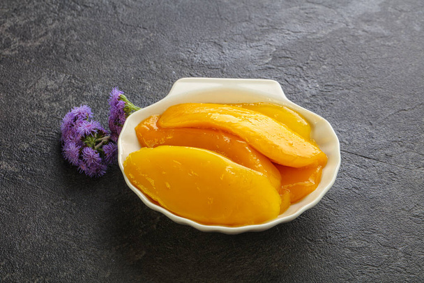 Sweet canned tropical fruit mango slices - Photo, Image