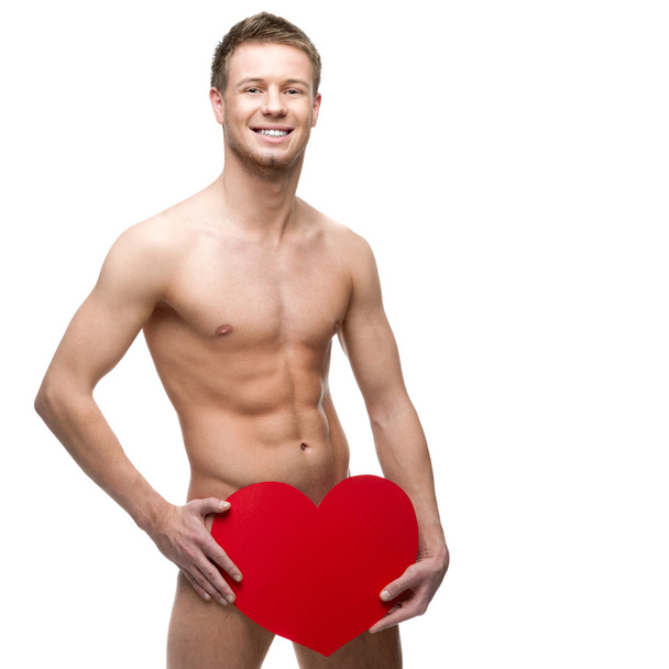 funny naked man holding big red paper heart - Фото, изображение